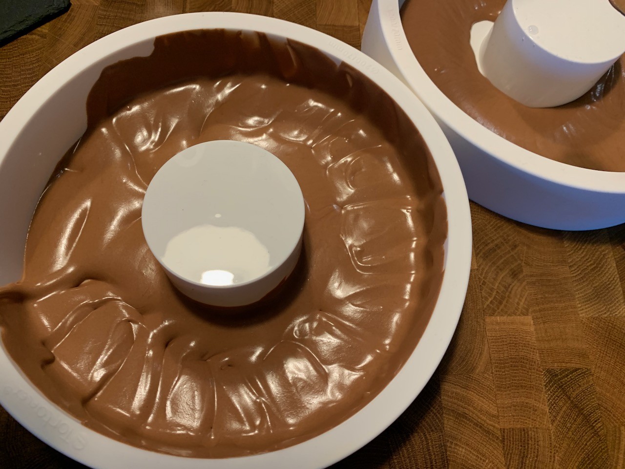 Filling the entremet mold with the first layer of mousse.